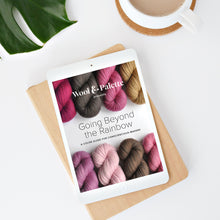 Load image into Gallery viewer, White iPad sitting on white table with a cup of coffee and a plant, the title of the artwork says Going Beyond the Rainbow