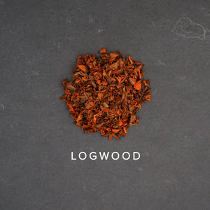 Logwood chips on dark slate background