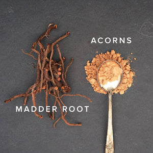 madder root and acorn powder on a dark slate background