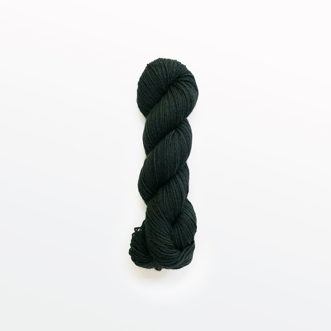 salamander fingering yarn, logwood, weld, & fustic wood, greenish black, naturally dyed yarn, non-superwash, 218 yards, bluefaced leicester wool