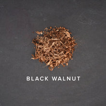 Load image into Gallery viewer, black walnut shavings on dark slate background
