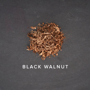 black walnut shavings on dark slate background